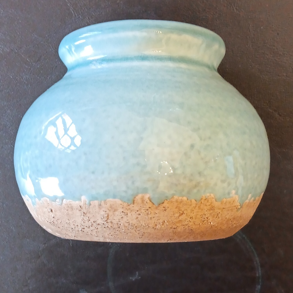 Handmade glazed robin's egg blue studio pottery. Unsigned. 6" wide. 4.5" tall.